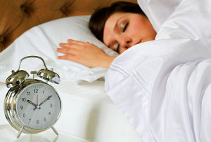 getty_rf_photo_of_woman_sleeping_late_in_bed